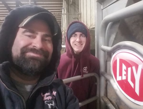 Charlie and Jacob Knigge with their Lely Astronaut A3 robotic milking system