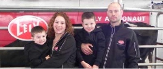 The Malenka Farm family in front of their Lely Astronaut A4 milking robot.