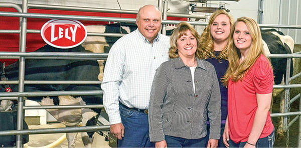 Nussbaum family in dairy barn