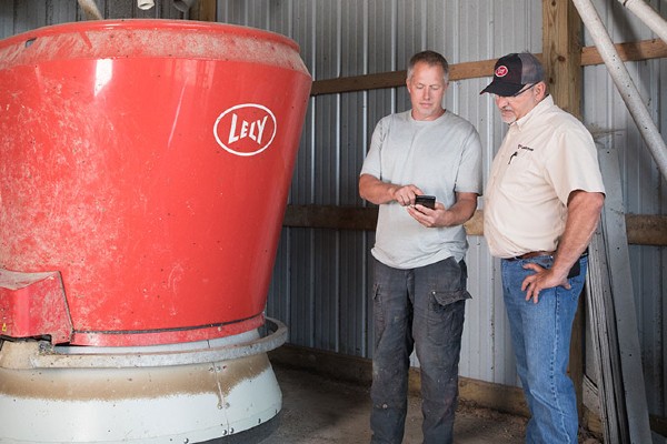 Lely product specialists with Lely vector automatic feeding system