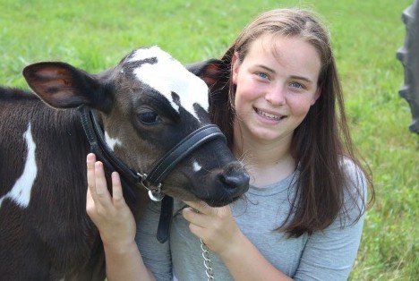 Lely scholarship winner Lynn Olthof with dairy cow