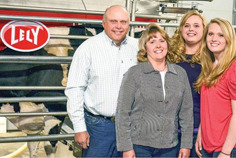 Nussman family in dairy barn